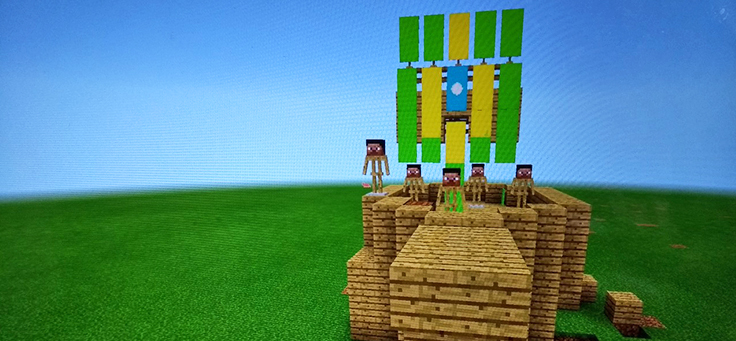 Cena de Minecraft, um dos jogos que podem ser usados por professores em sala de aula, mostra bonequinhos em cima de uma fortaleza.