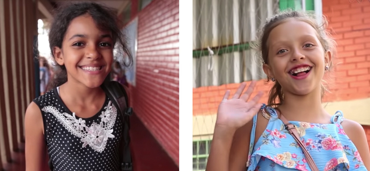 Imagens do vídeo do Dia do Estudante mostram 2 meninas sorrindo para a câmera.