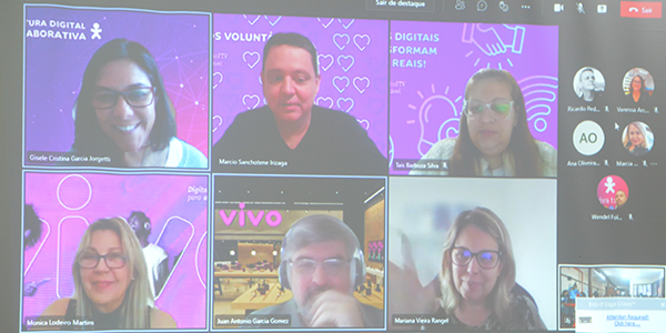 Imagem mostra a tela de um computador com os voluntários participantes de uma live